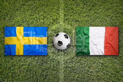 Sweden vs. Italy flags on soccer field