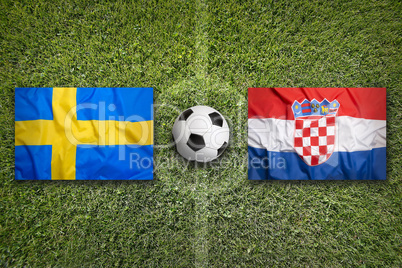 Sweden vs. Croatia flags on soccer field