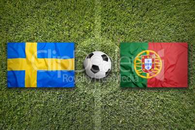 Sweden vs. Portugal flags on soccer field