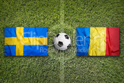 Sweden vs. Romania flags on soccer field