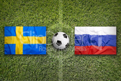 Sweden vs. Russia flags on soccer field