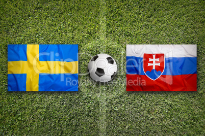 Sweden vs. Slovakia flags on soccer field