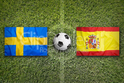 Sweden vs. Spain flags on soccer field