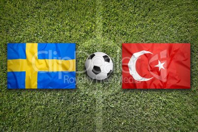 Sweden vs. Turkey flags on soccer field