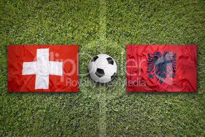 Switzerland vs. Albania flags on soccer field