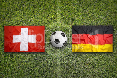 Switzerland vs. Germany flags on soccer field