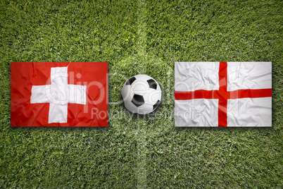 Switzerland vs. England flags on soccer field