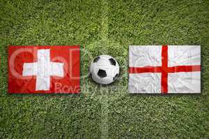 Switzerland vs. England flags on soccer field
