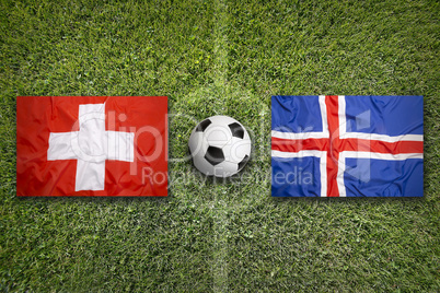 Switzerland vs. Iceland flags on soccer field