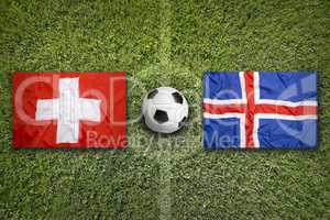 Switzerland vs. Iceland flags on soccer field