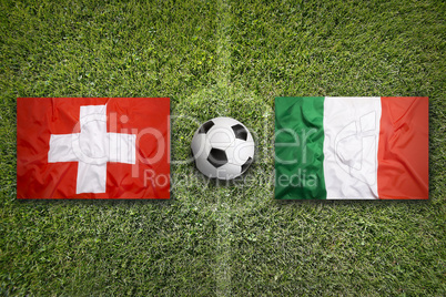Switzerland vs. Italy flags on soccer field