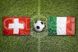 Switzerland vs. Italy flags on soccer field