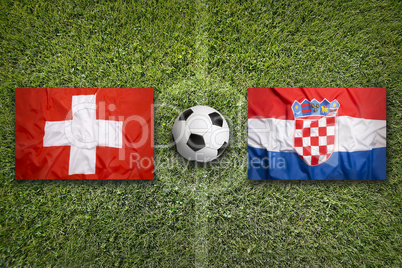 Switzerland vs. Croatia flags on soccer field