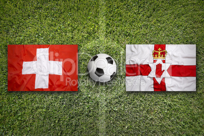 Switzerland vs. Northern Ireland flags on soccer field