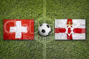Switzerland vs. Northern Ireland flags on soccer field