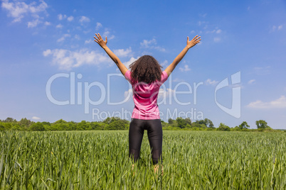 Female Woman Girl Runner Arms Raised in Green Field
