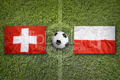 Switzerland vs. Poland flags on soccer field