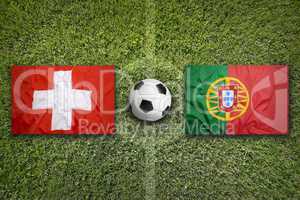 Switzerland vs. Portugal flags on soccer field