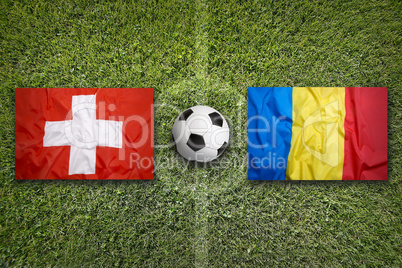 Switzerland vs. Romania flags on soccer field