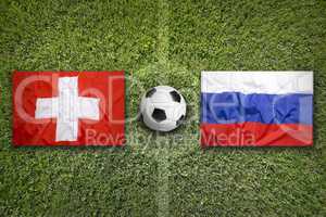 Switzerland vs. Russia flags on soccer field