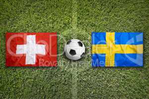 Switzerland vs. Sweden flags on soccer field