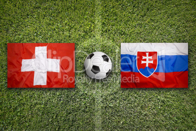 Switzerland vs. Slovakia flags on soccer field
