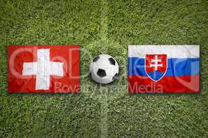Switzerland vs. Slovakia flags on soccer field