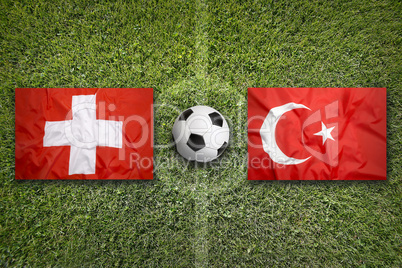 Switzerland vs. Turkey flags on soccer field