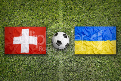 Switzerland vs. Ukraine flags on soccer field