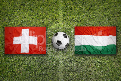 Switzerland vs. Hungary flags on soccer field