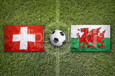 Switzerland vs. Wales flags on soccer field
