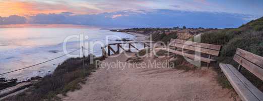 Bench along an outlook with a view of Crystal Cove Beach