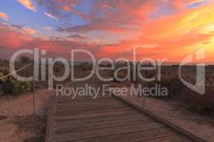 Boardwalk at Crystal Cove beach in California at sunset