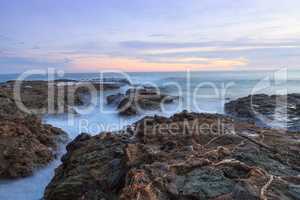 Long exposure of sunset over rocks