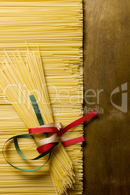 Pasta spaghetti tied with ribbons of the flag colors of Italy