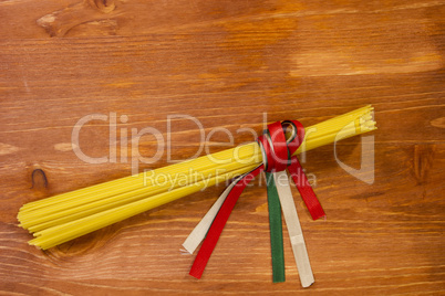 Pasta spaghetti tied with ribbons of the flag colors of Italy