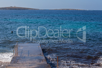 Cement pier and blue sea