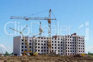 Construction of a multistory building. Cranes work