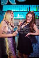 Female friends enjoying at nightclub