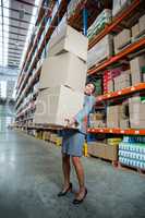 Business woman holding boxes