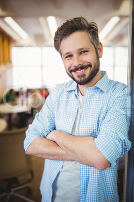 Portrait of cheerful businessman in office cafeteria