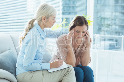 Therapist comforting her patient