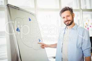 Businessman giving presentation in creative office