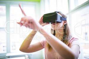 Graphic designer gesturing while using virtual reality headset