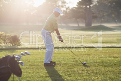 Side view of man playing golf