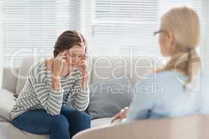 Sad woman with therapist