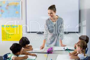 Female teacher teaching students