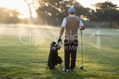 Full length Rear view of golfer