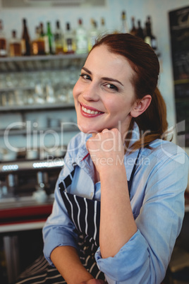 Portrait of confident barista at coffee house