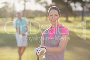 Portrait of smiling golfer woman